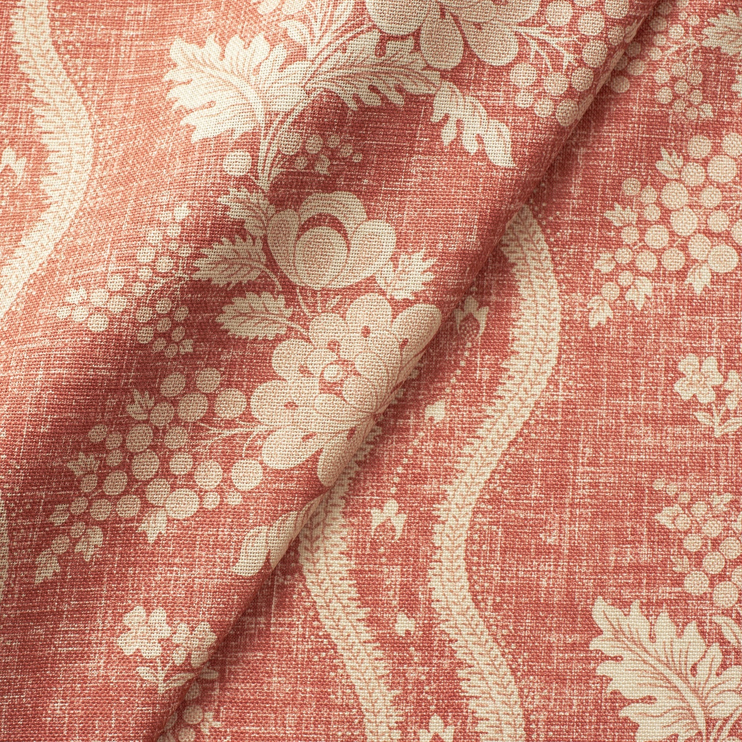 Fabric swatch of a red floral fabric with striped design for curtains and upholstery