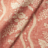 Fabric swatch of a red floral fabric with striped design for curtains and upholstery