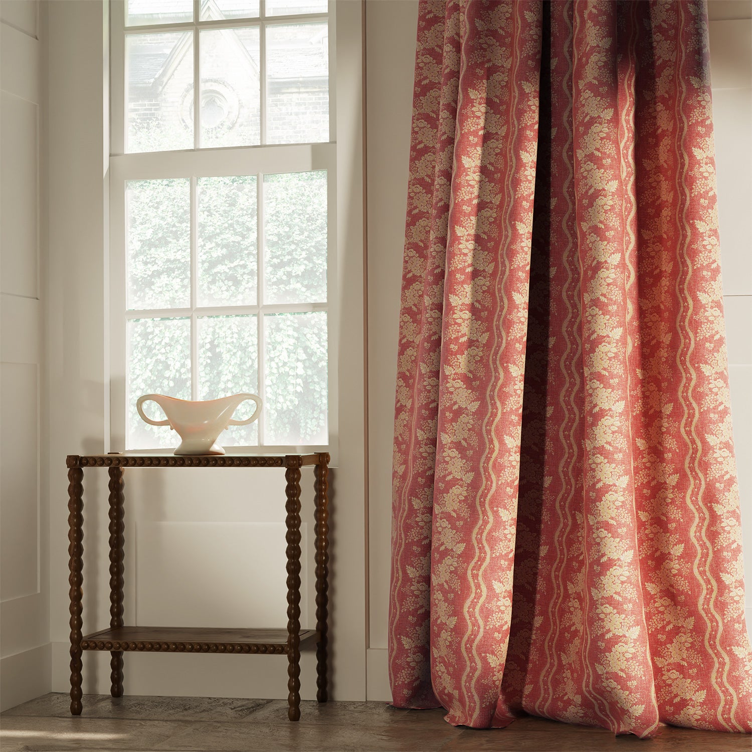 Curtains in a classic red floral fabric with stripe design