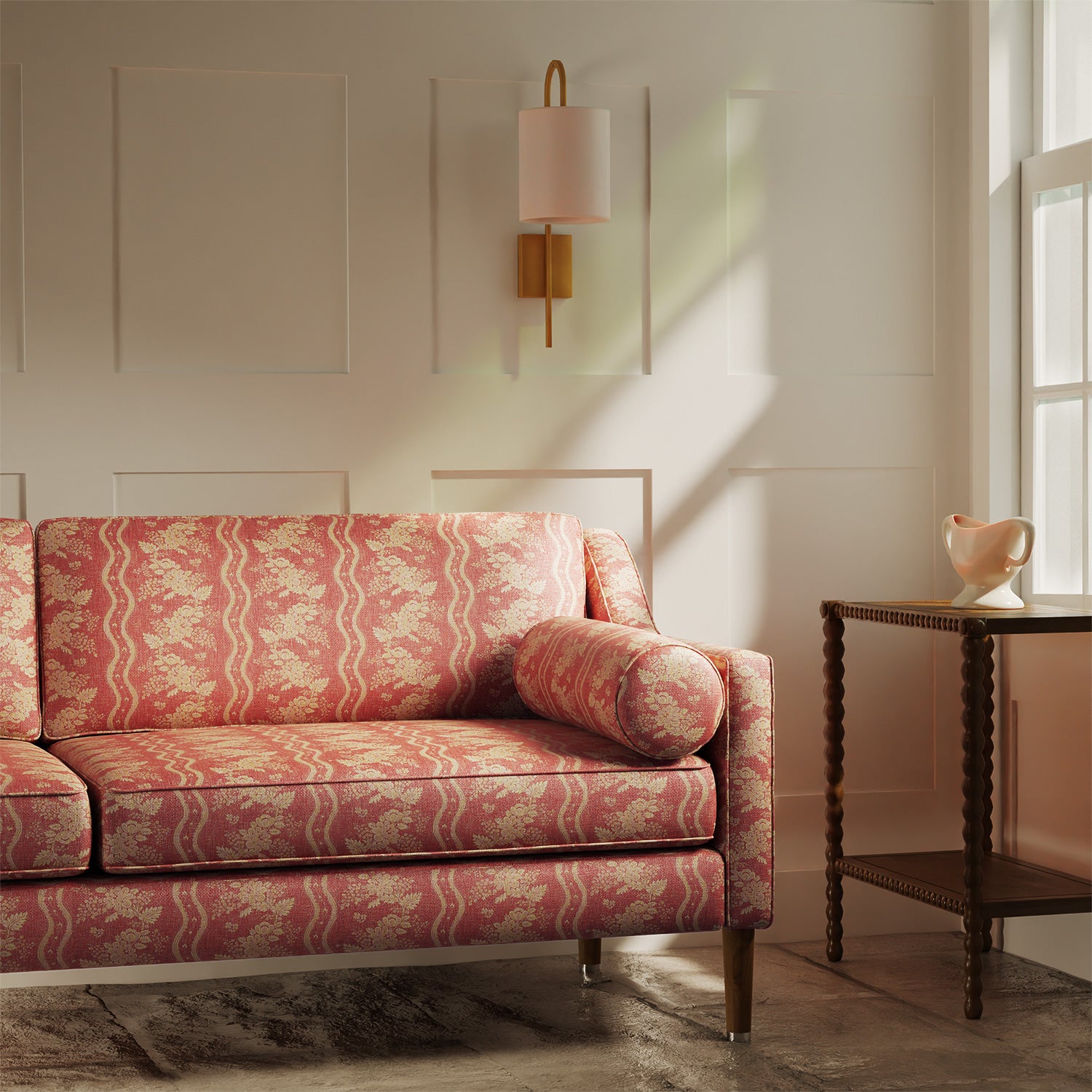 Sofa upholstered in a red floral fabric with stripe design