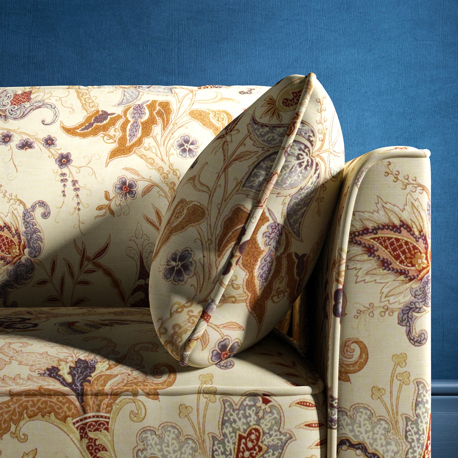 Sofa with a cream fabric with a stylised floral design