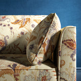 Sofa with a cream fabric with a stylised floral design