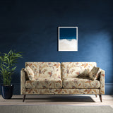 Sofa with a cream fabric with a stylised floral design