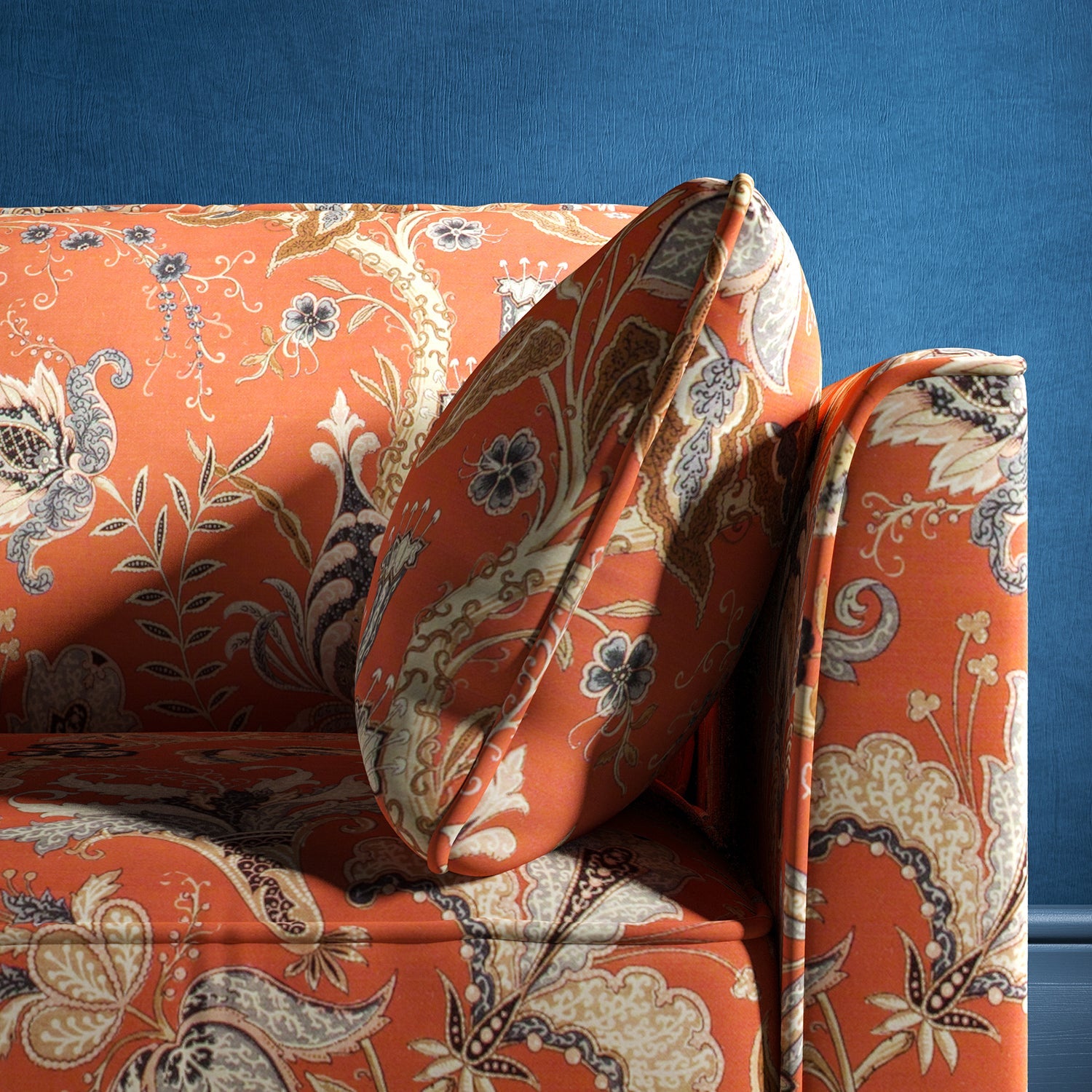 Sofa with a orange fabric with a stylised floral design