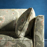 Sofa with a grey fabric with stylised floral design