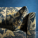 Sofa with a navy blue fabric with stylised floral design
