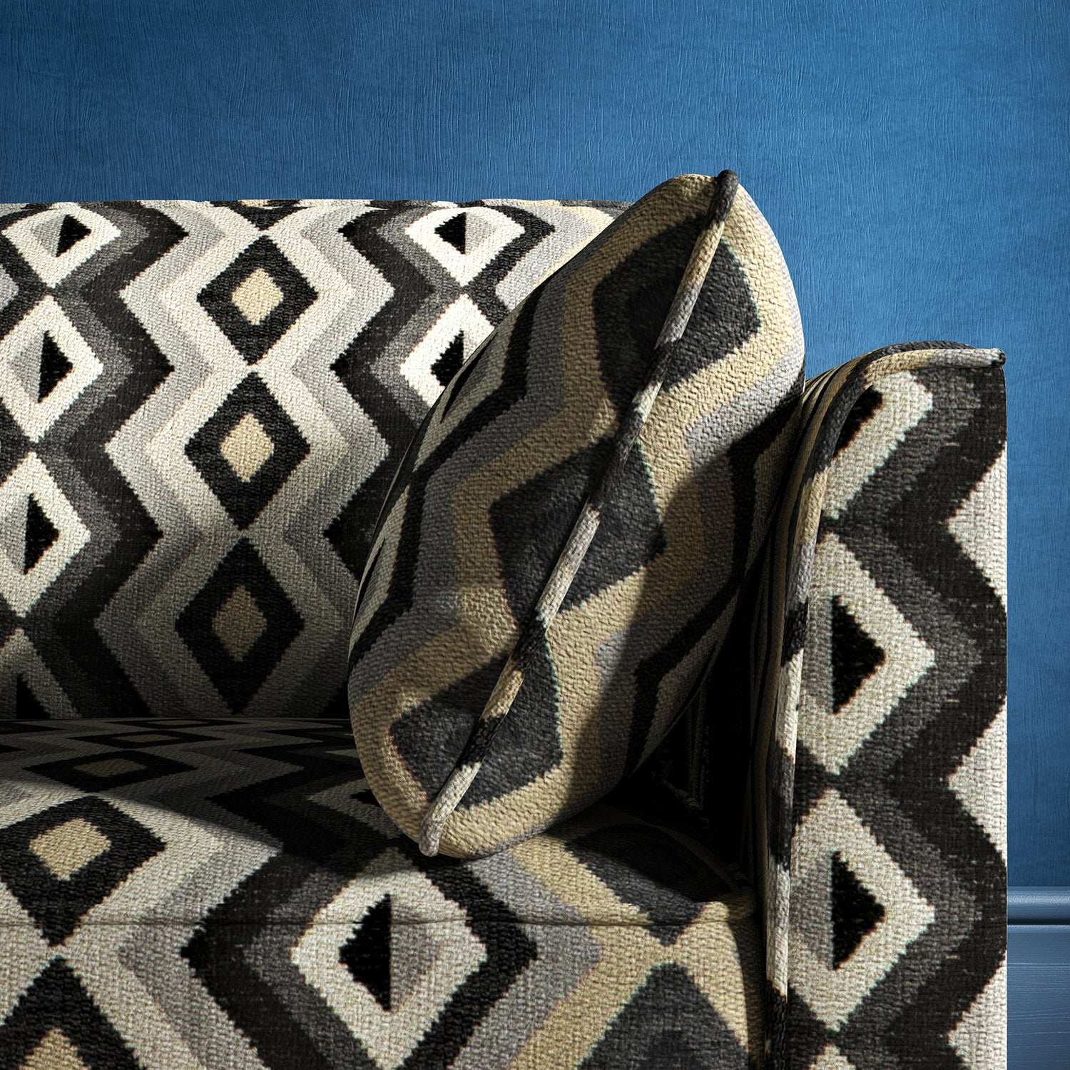 Sofa upholstered in a black and white upholstery fabric with geometric Navajo inspired design