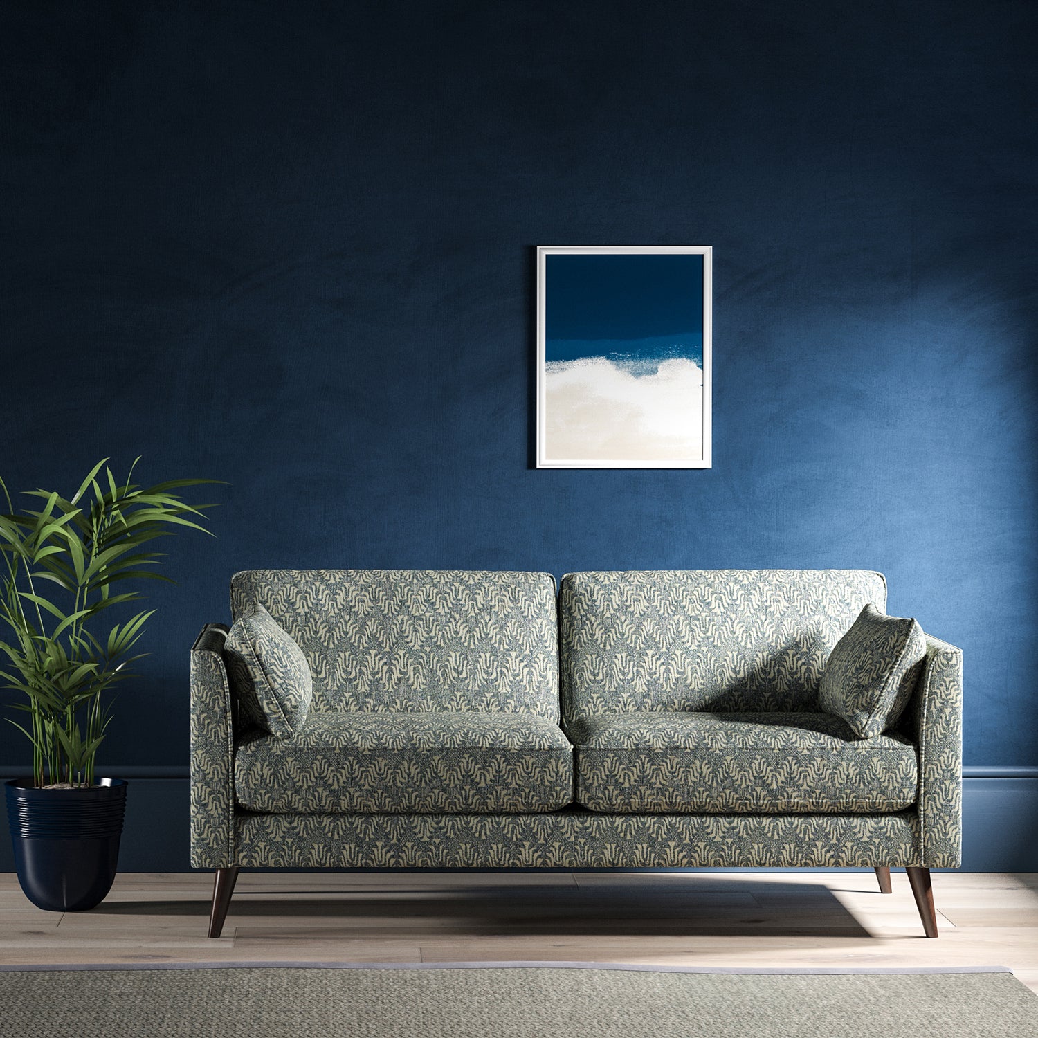 Sofa upholstered in a blue and neutral jacquard weave upholstery fabric