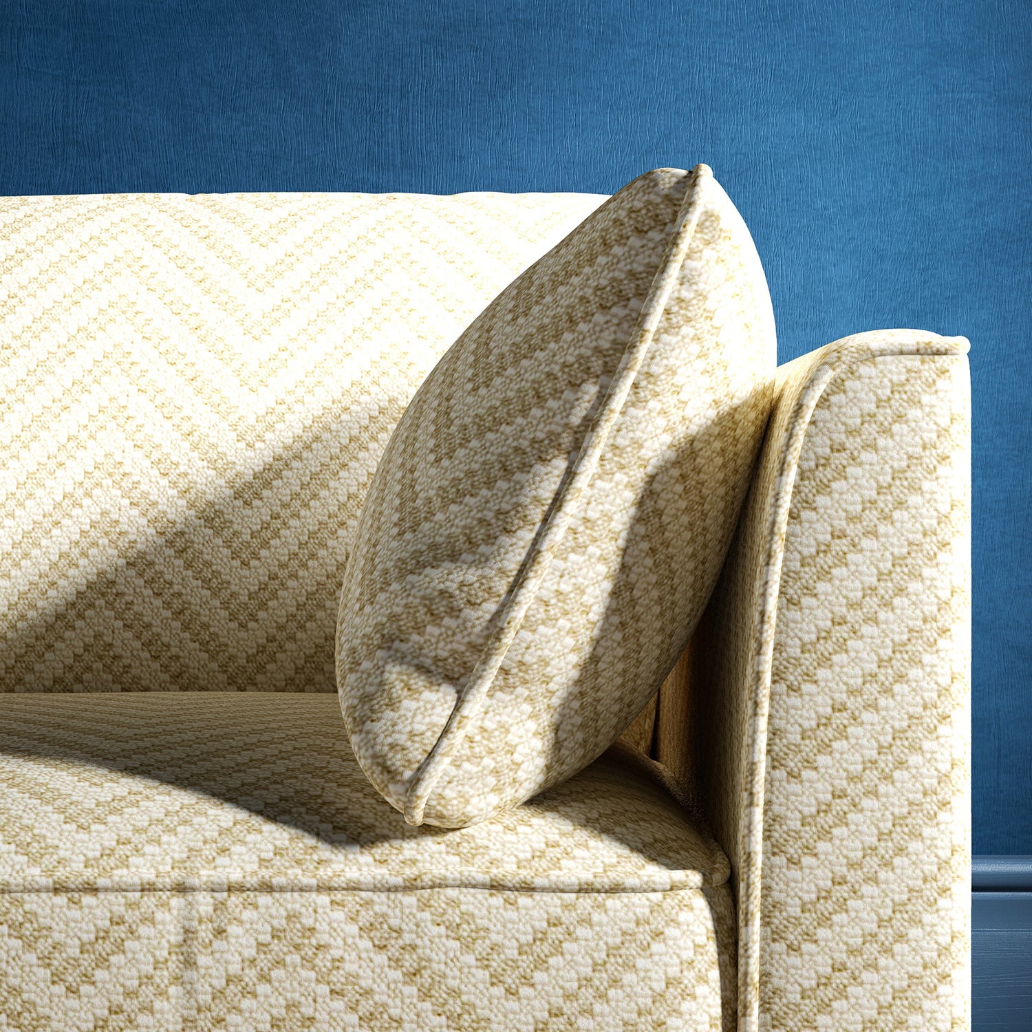 Sofa upholstered in a neutral herringbone upholstery fabric