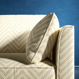 Sofa upholstered in a neutral herringbone upholstery fabric
