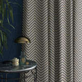Curtain in a navy and neutral herringbone weave fabric