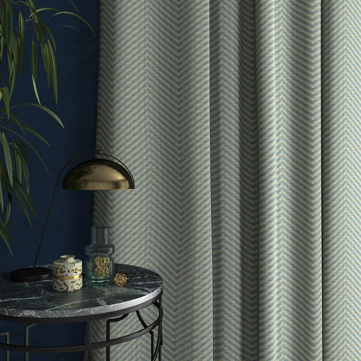 Sofa upholstered in a blue herringbone weave upholstery fabric