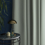 Sofa upholstered in a blue herringbone weave upholstery fabric