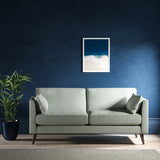Sofa upholstered in a blue herringbone weave upholstery fabric