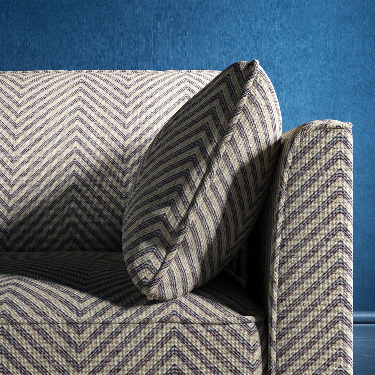 Sofa upholstered in a navy herringbone weave upholstery fabric
