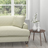 Sofa in a grey fabric with a white geometric woven design