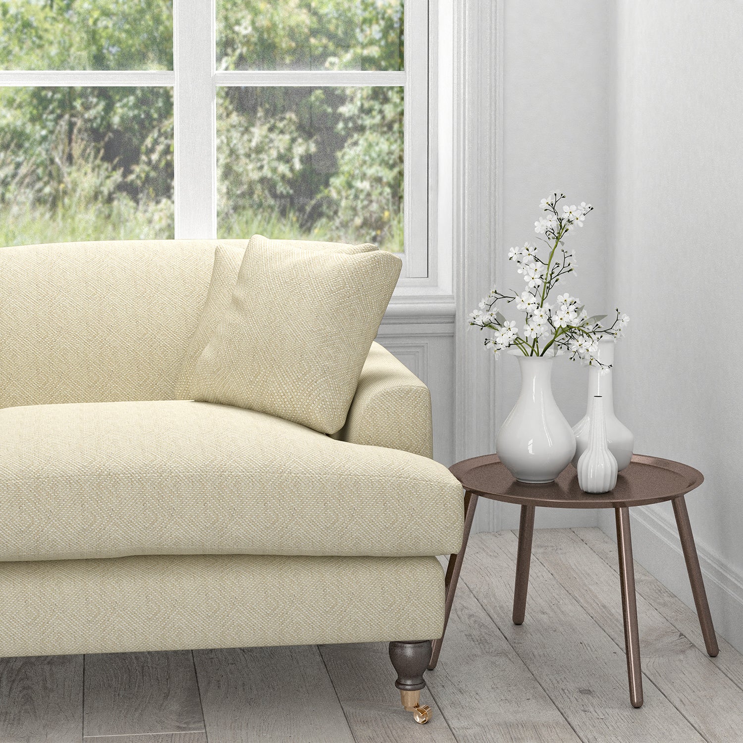 Sofa in a cream fabric with a white woven geometric design