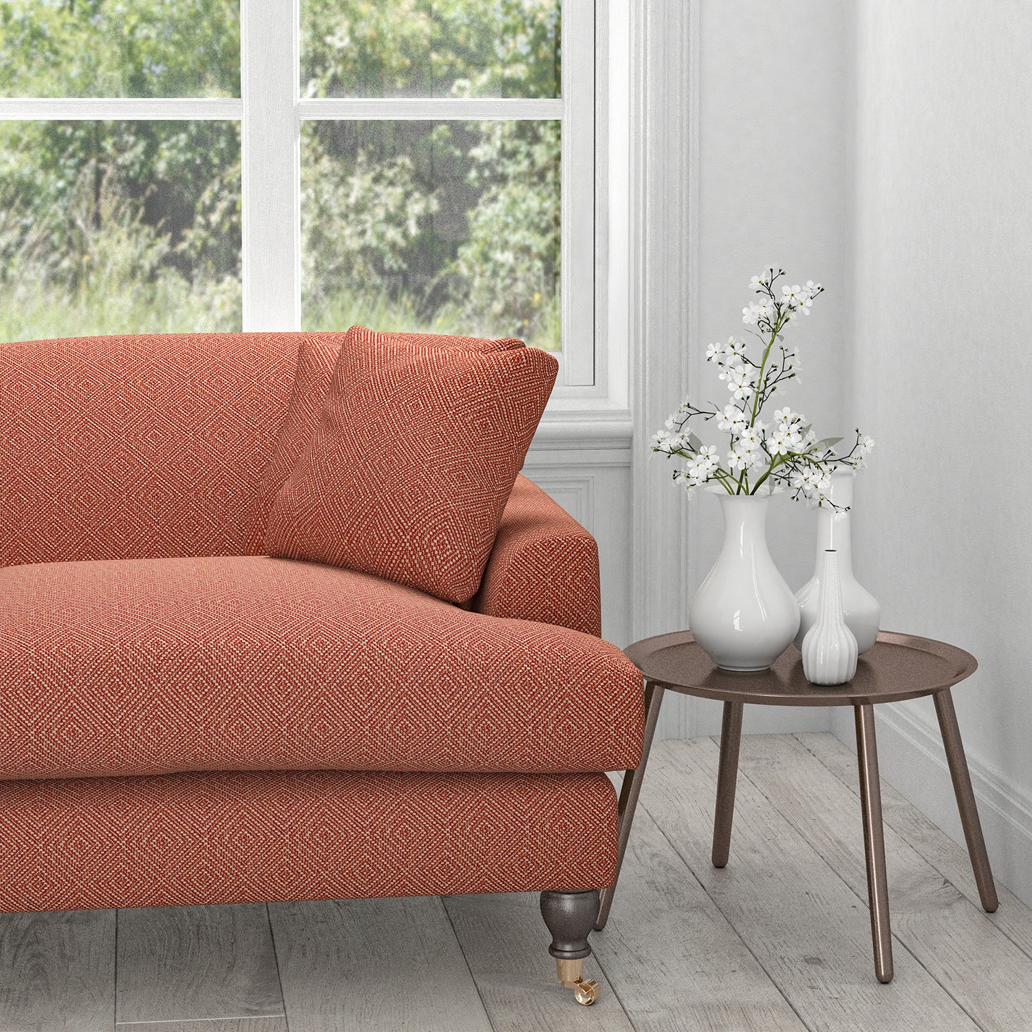 Sofa in a terracotta fabric with a light woven neutral geometric design
