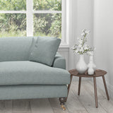 Sofa in a light blue fabric with woven geometric design