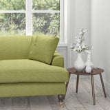 Sofa in a green fabric with woven geometric design