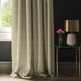 Curtain in a fabric with a neutral geometric weave design