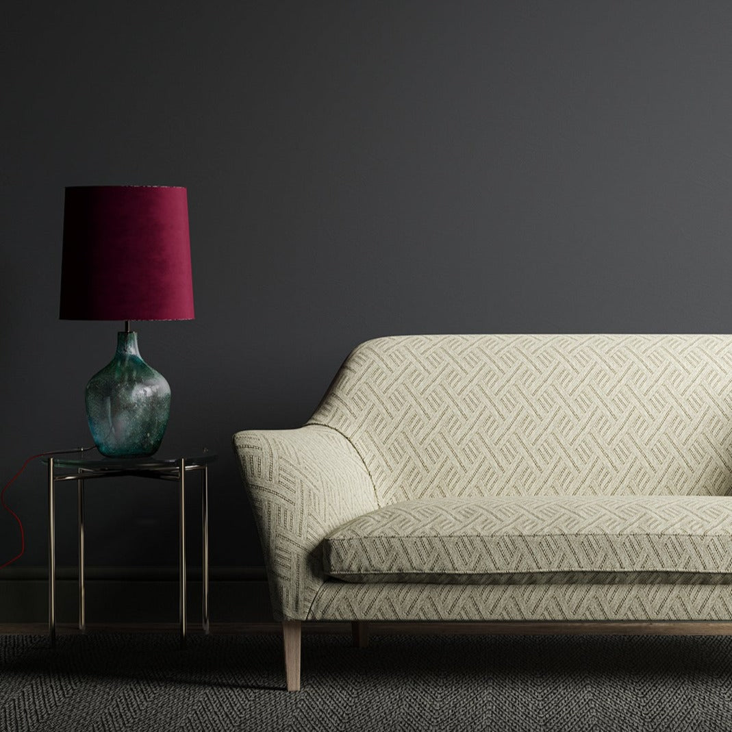 Sofa in an upholstery fabric with a geometric weave and neutral colours