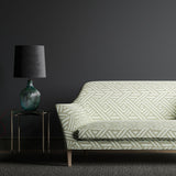Sofa upholstered in a grey and white print fabric with a large scale geometric design