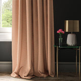 Curtain in a orange and off white geometric weave fabric