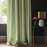 Curtain made with a light green, pink and cream geometric weave fabric