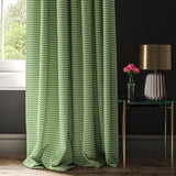 Curtain in a small scale green white and black geometric weave.