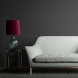 Sofa upholstered in a light blue and white geometric weave fabric.