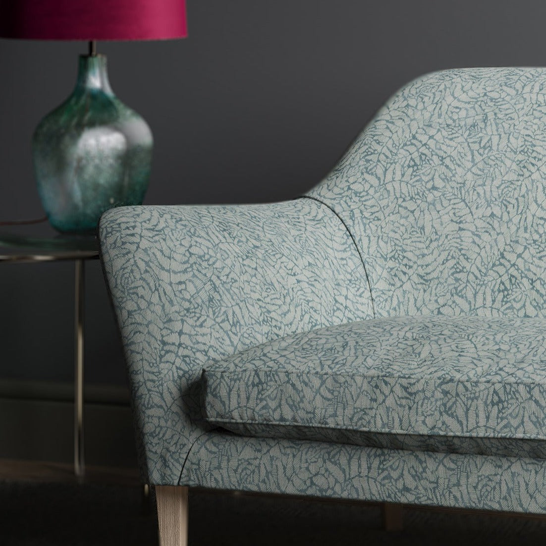 Sofa in a blue fabric with a small white print