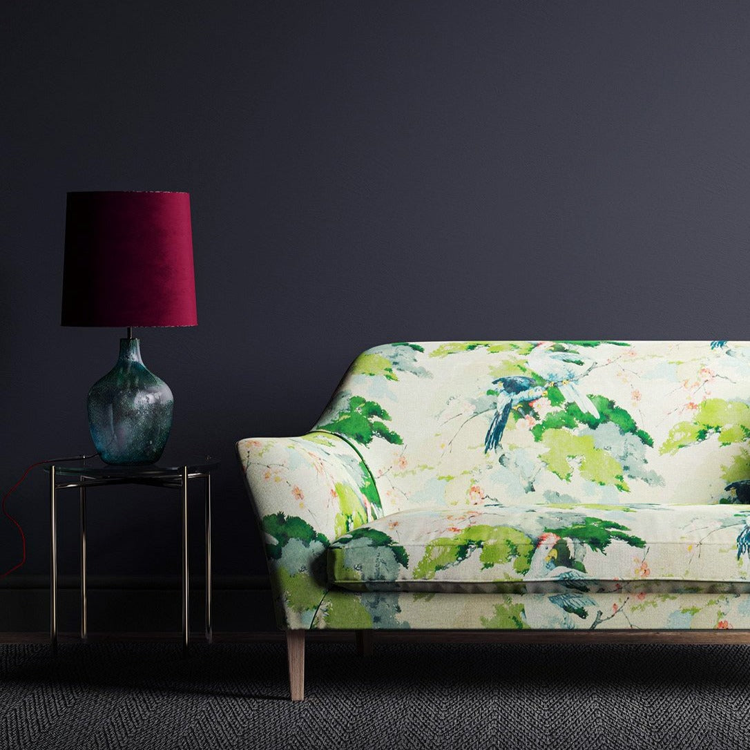 Sofa in a light linen fabric with a tropical bird design