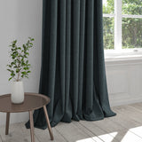 Curtain in a dark blue washable cotton fabric with a stain resistant finish