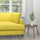 Sofa in a plain bright yellow cotton furnishing fabric