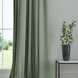 Curtain in a plain fabric, colour Lichen.