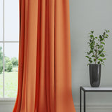 Curtain in a plain fabric, colour Tangerine.