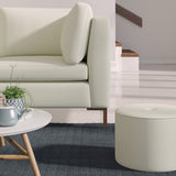 Living room with a contemporary sofa upholstered in a grey semi-plain Scandi-style upholstery fabric