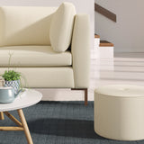 Living room with a contemporary sofa upholstered in a orange semi-plain Scandi-style upholstery fabric