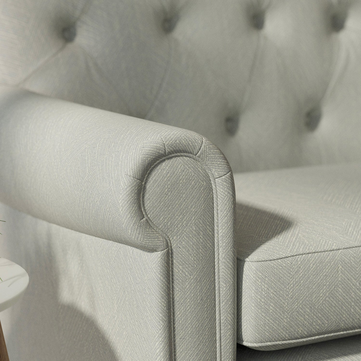 Sofa upholstered in a light blue Scandi-style semi-plain upholstery fabric with a stain resistant finish