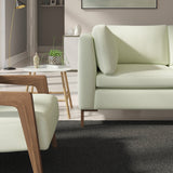 Living room with a contemporary sofa upholstered in a light blue semi-plain Scandi-style upholstery fabric