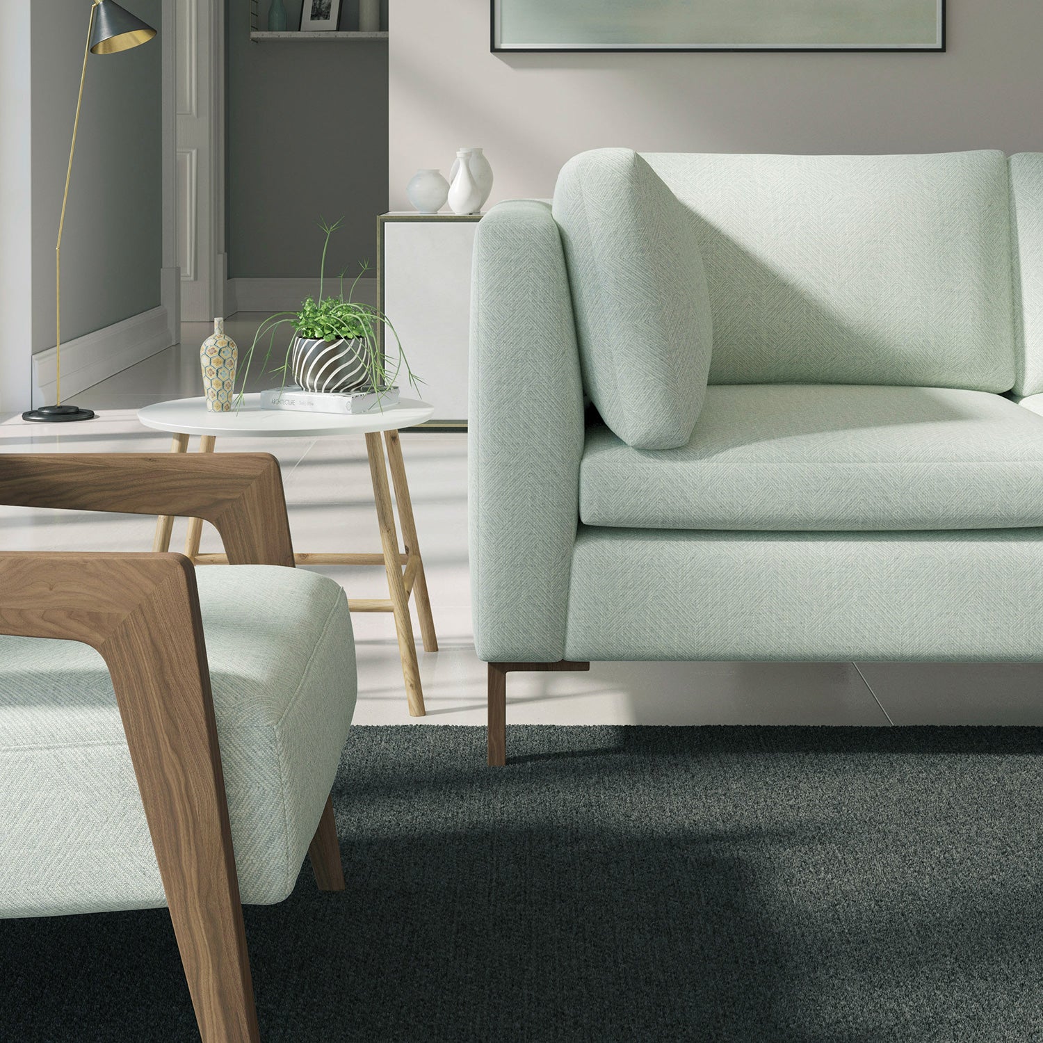 Living room with a contemporary sofa upholstered in a blue semi-plain Scandi-style upholstery fabric