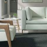 Living room with a contemporary sofa upholstered in a blue semi-plain Scandi-style upholstery fabric