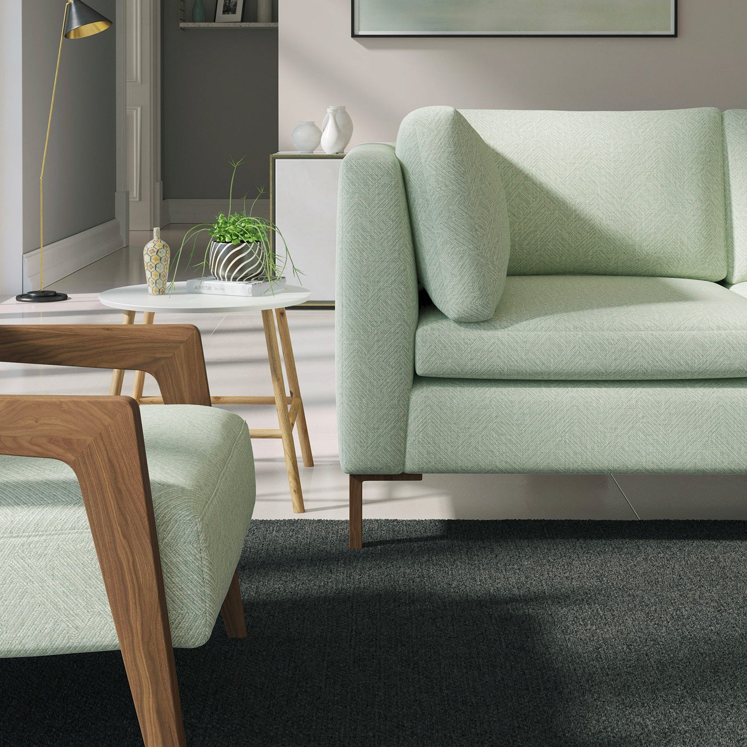 Living room with a contemporary sofa upholstered in a aqua semi-plain Scandi-style upholstery fabric