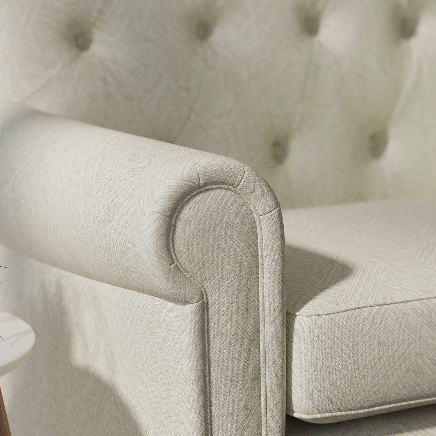 Sofa upholstered in a light neutral Scandi-style semi-plain upholstery fabric with a stain resistant finish