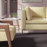 Living room with a contemporary sofa upholstered in a yellow semi-plain Scandi-style upholstery fabric