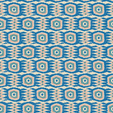 Fabric swatch of a printed velvet fabric featuring a fun, jazzy pattern in blue, green and pink.