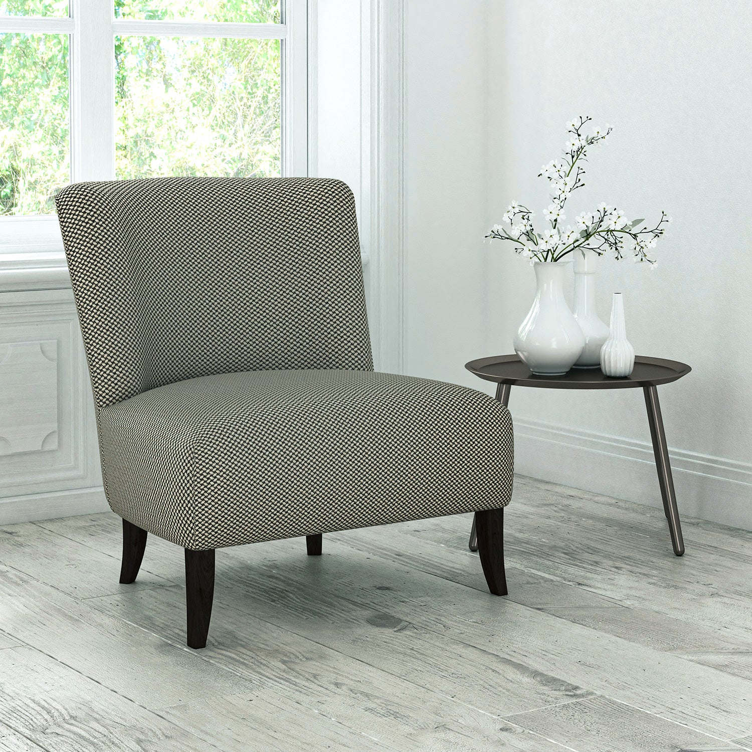 Chair upholstered in a dark grey stain resistant geometric weave fabric
