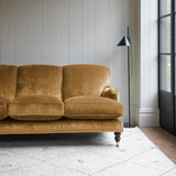 Velvet sofa in a yellow crushed velvet upholstery fabric