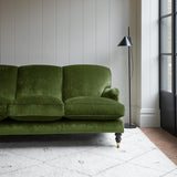 Velvet sofa in a dark green crushed velvet upholstery fabric